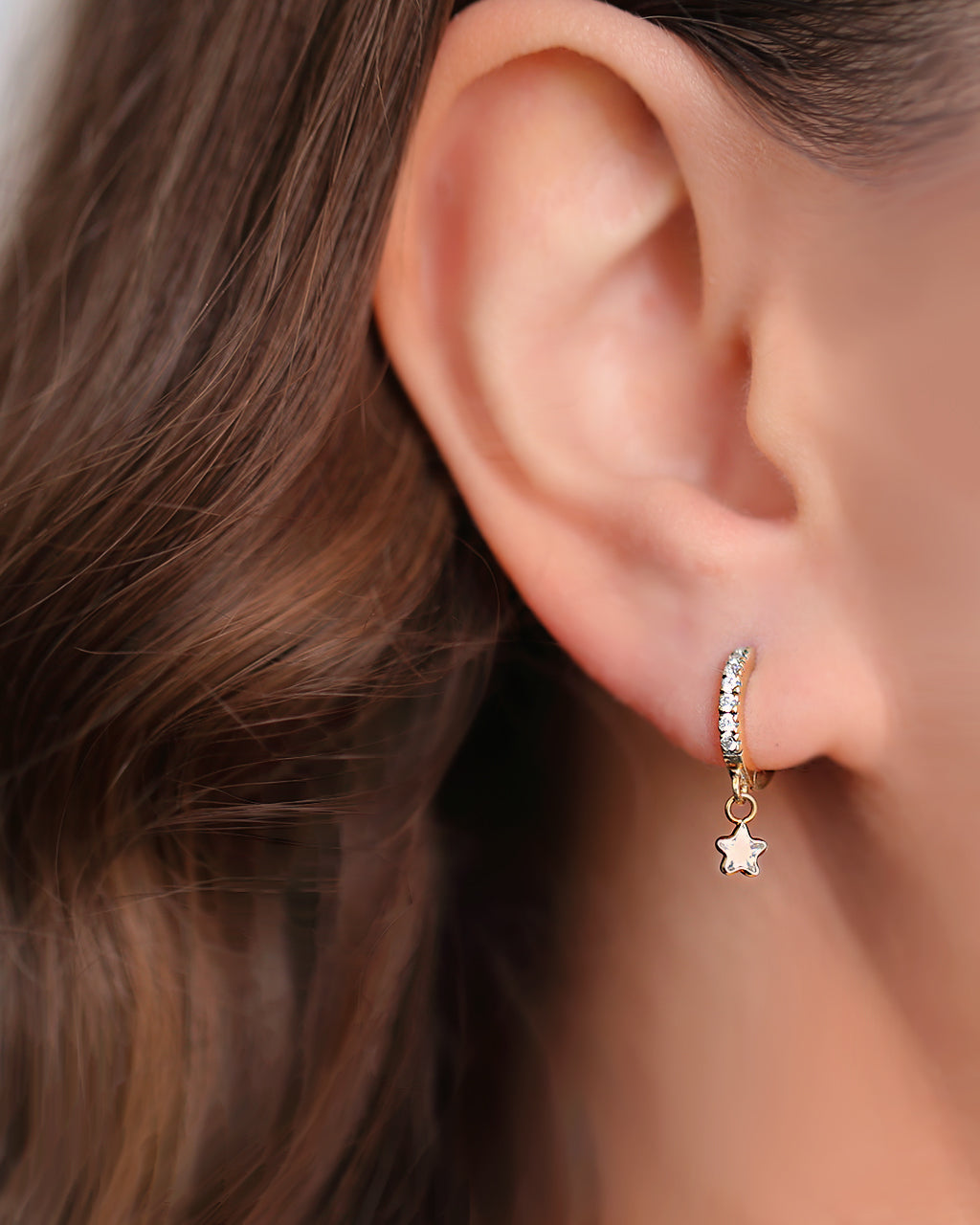 Gold huggie hoops with star charm